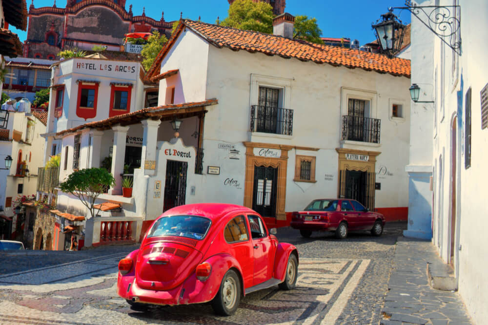 Architecture and taxi of Taxco, Mexico - a town known for its silver products.