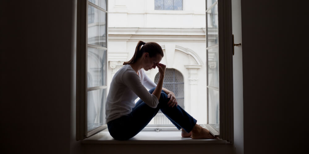 Lonely woman by the window