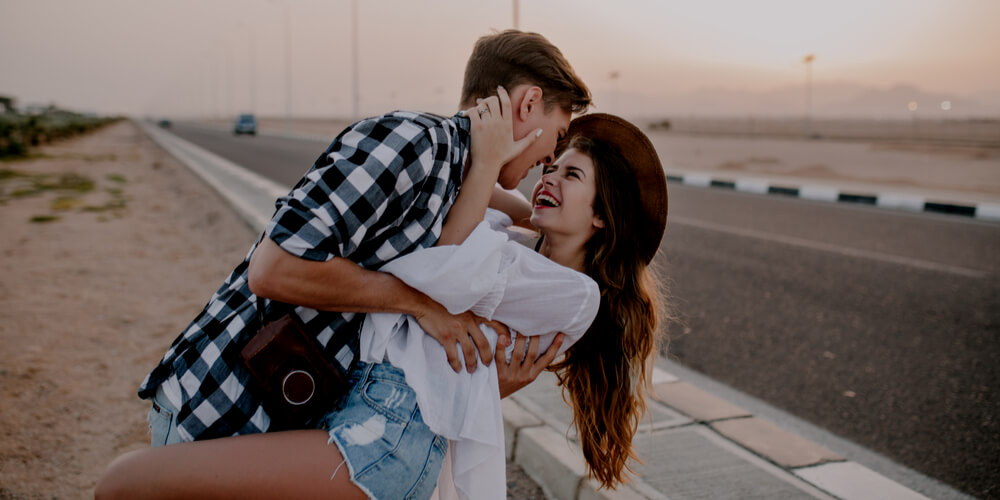 Couple near a road in summer