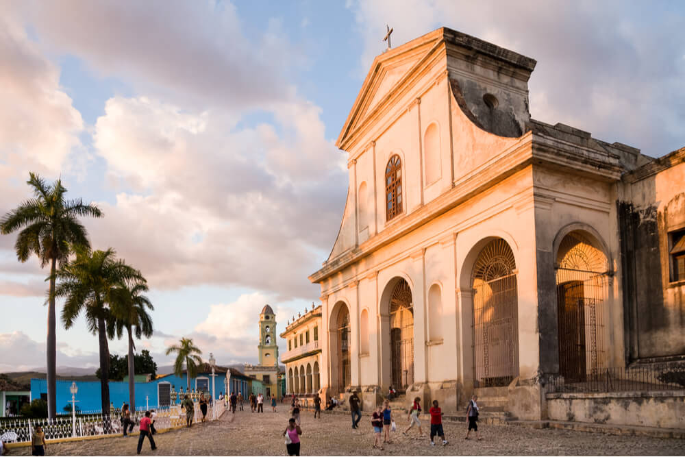 Colonial Holy Trinity cathedral glowing in the sunset in the main square of Trinidad, Cuba