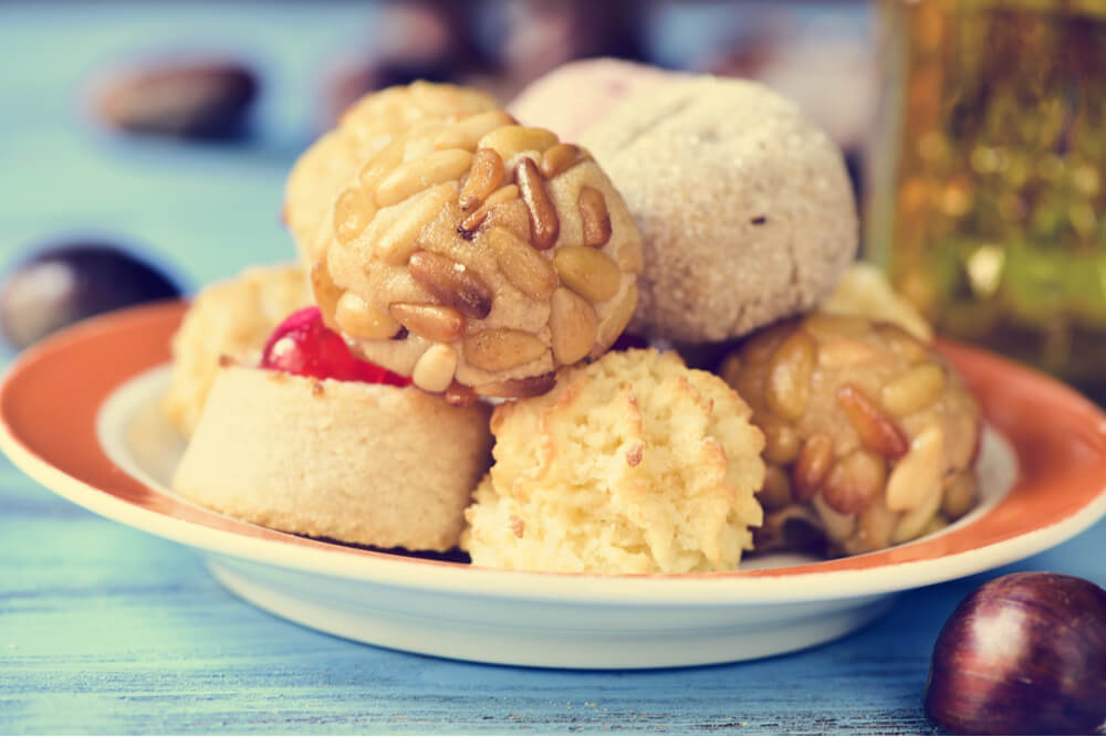 Spanish panellets are small cakes made of marzipan and almonds and served with wine