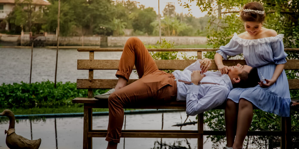 Happy couple on a bench in a park