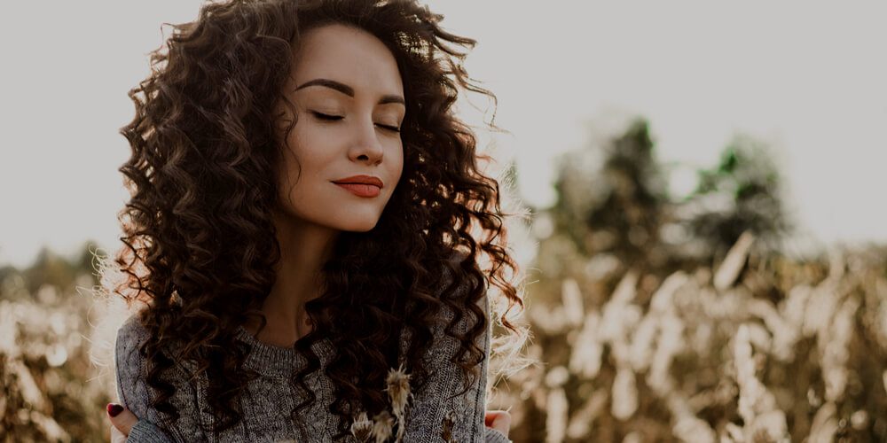 Attractive girl in a field in September