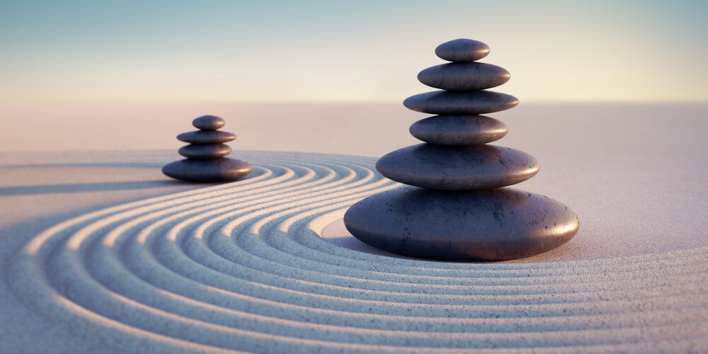 Zen and stones on sand