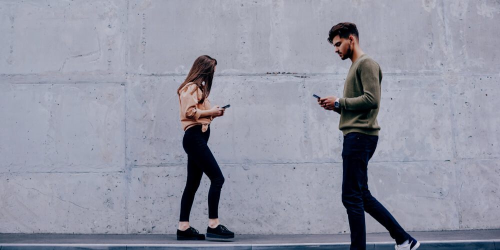 A girl and a man ignoring each other