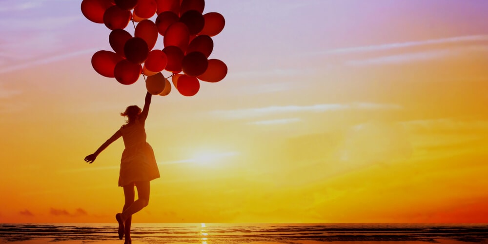 Happy girl with balloons