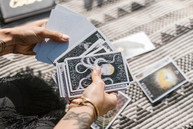 woman shuffling taro cards