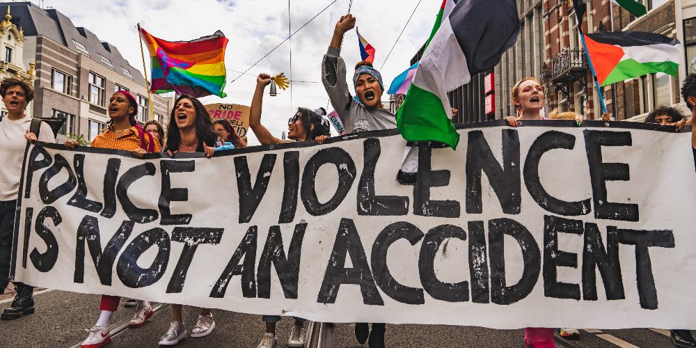 Protestors take to the streets with signs after a string of police brutality incidents.