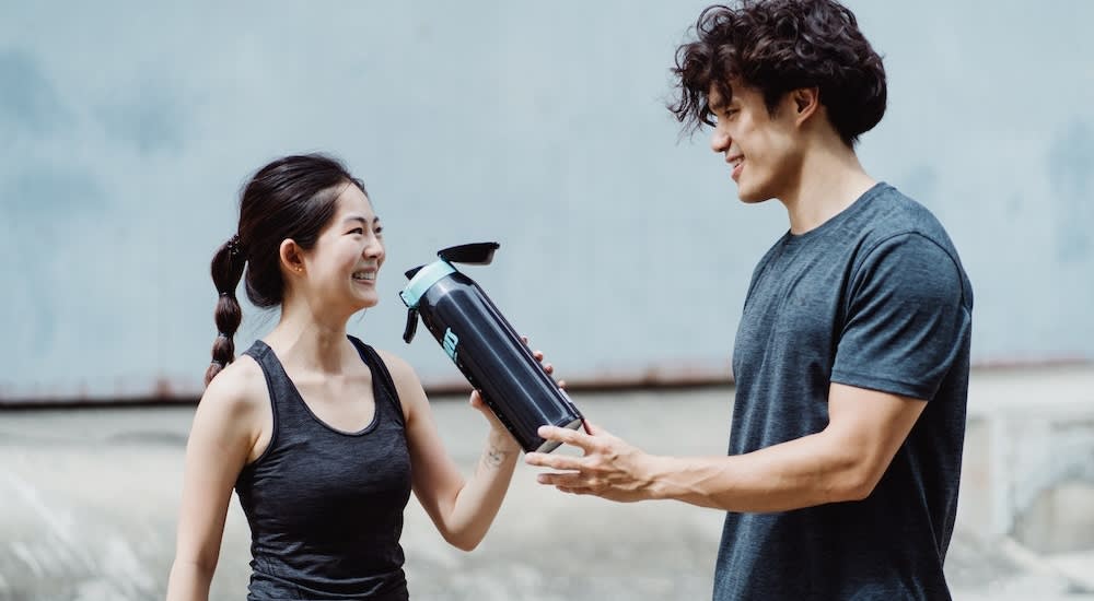 A healthy couple enjoys staying consistent in an exercise routine together.