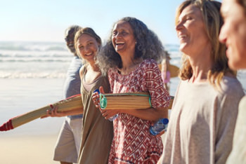 Women laughing at the beach Womem together at beach laughing