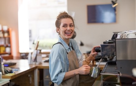 Woman barista smiling 