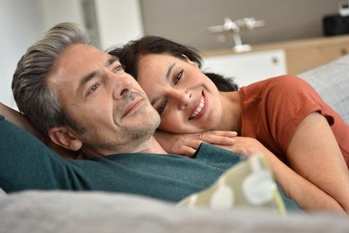 coupe lies on bed couple experiencing prostrate cancer