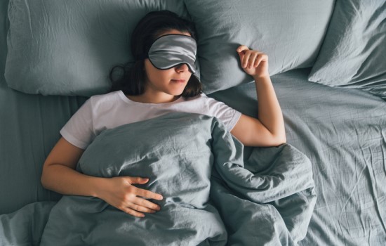 Lady sleeping Lady sleeping with sleep mask over eyes