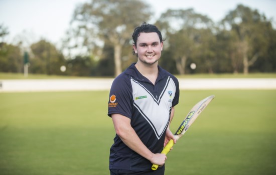 Boy playing blind cricket