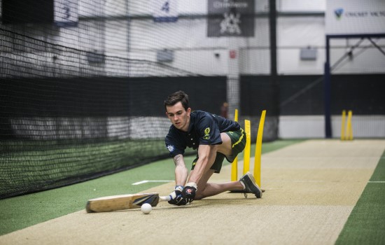 Young man playing blind cricket