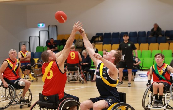 Girl playing Wheelchair Aussie Rules