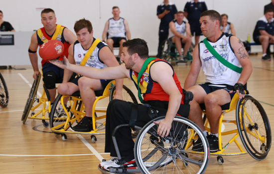 Girl playing Wheelchair Aussie Rules