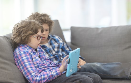 Two boys using assistive technology Two boys using assistive technology