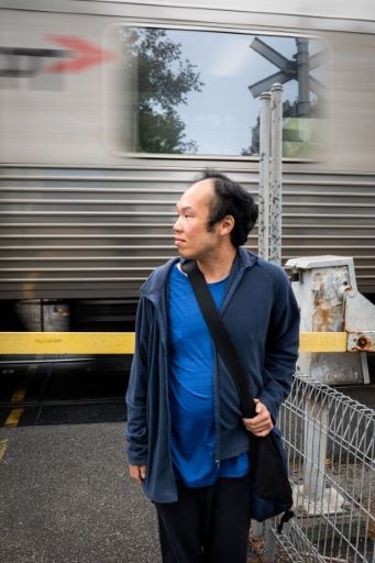 Man waiting at train station