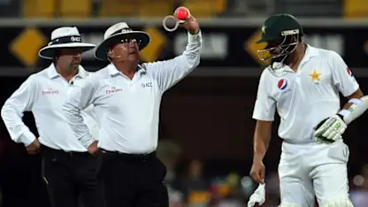 Logo of ICC umpires inspect the pink ball during a day/night test match