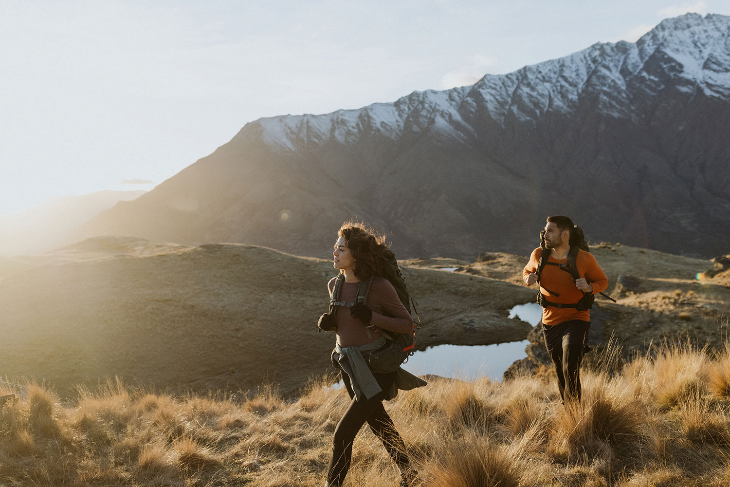 Man and Woman wearing Merino 200 Oasis Long Sleeve Crewe Thermal Top base layers