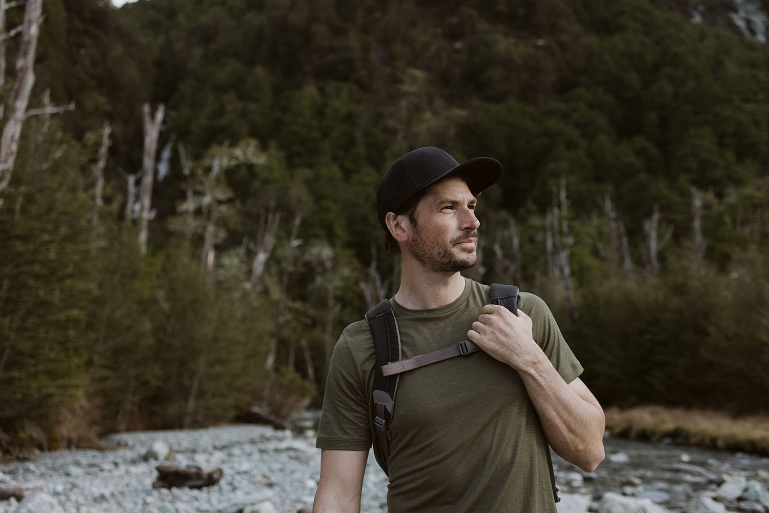 man hiking wearing Loden Merino Tech Lite II Short Sleeve Tee first layer