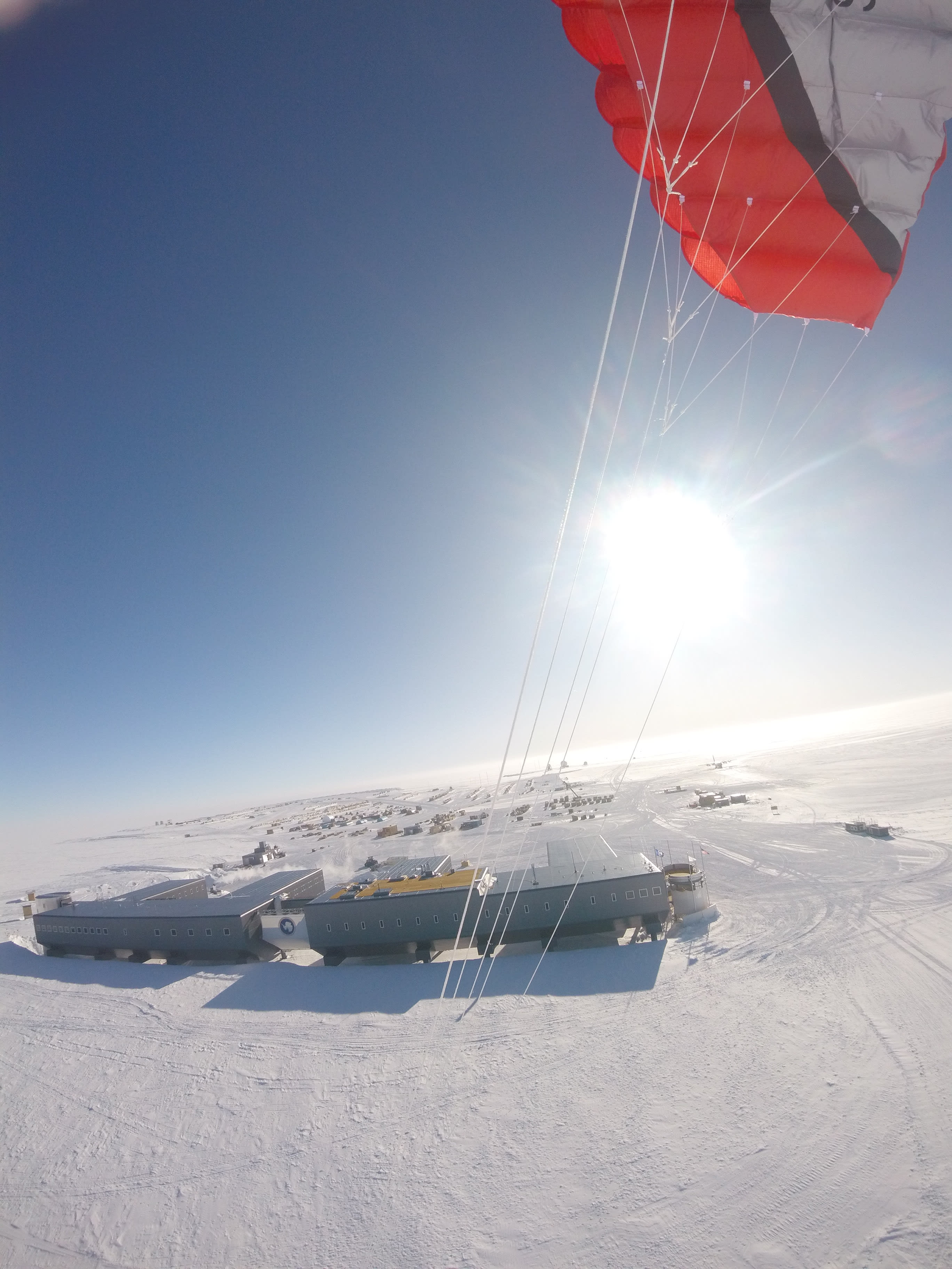 An aerial view of the South Pole station on a clear sunny day, taken from a camera attached to a kite.