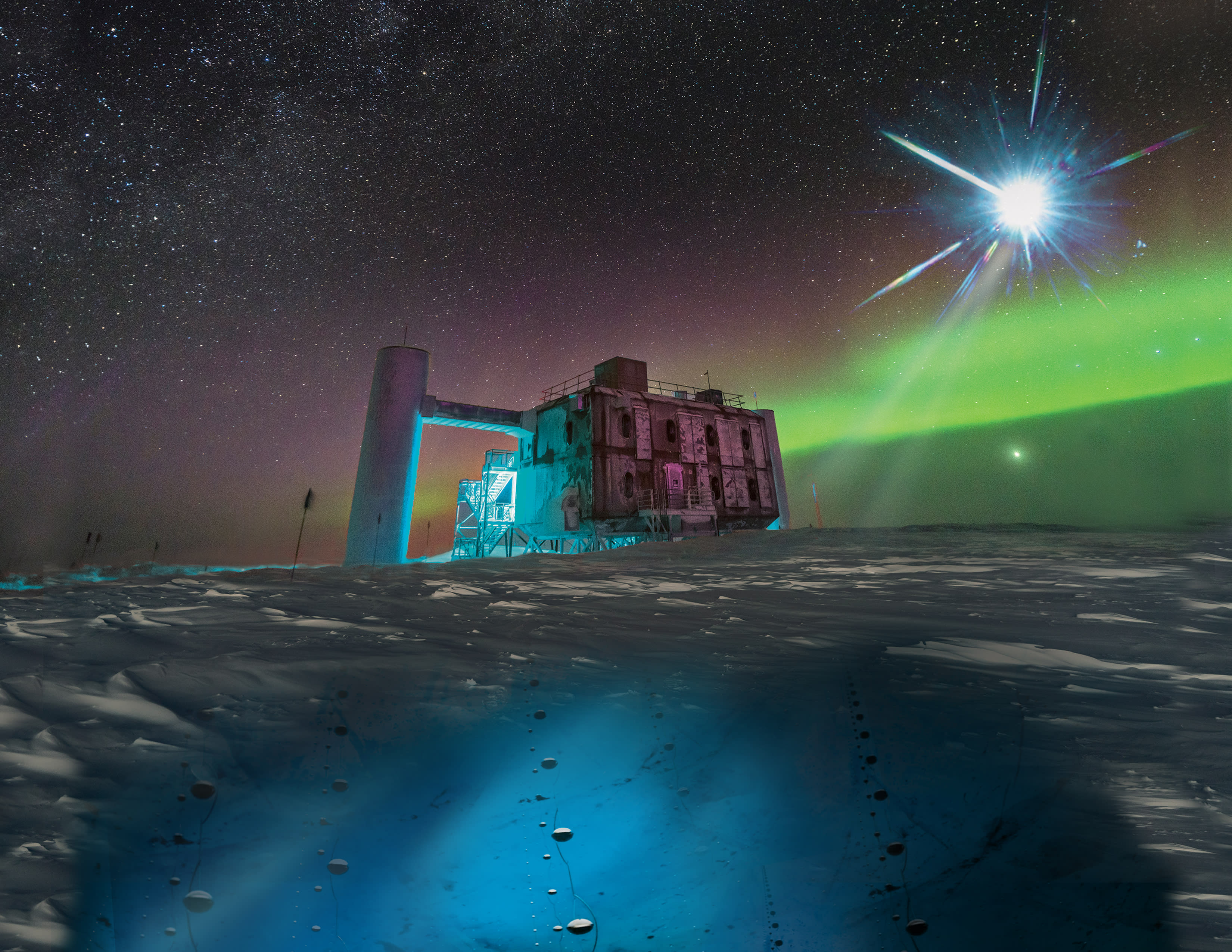 The IceCube Lab at the South Pole with aurora