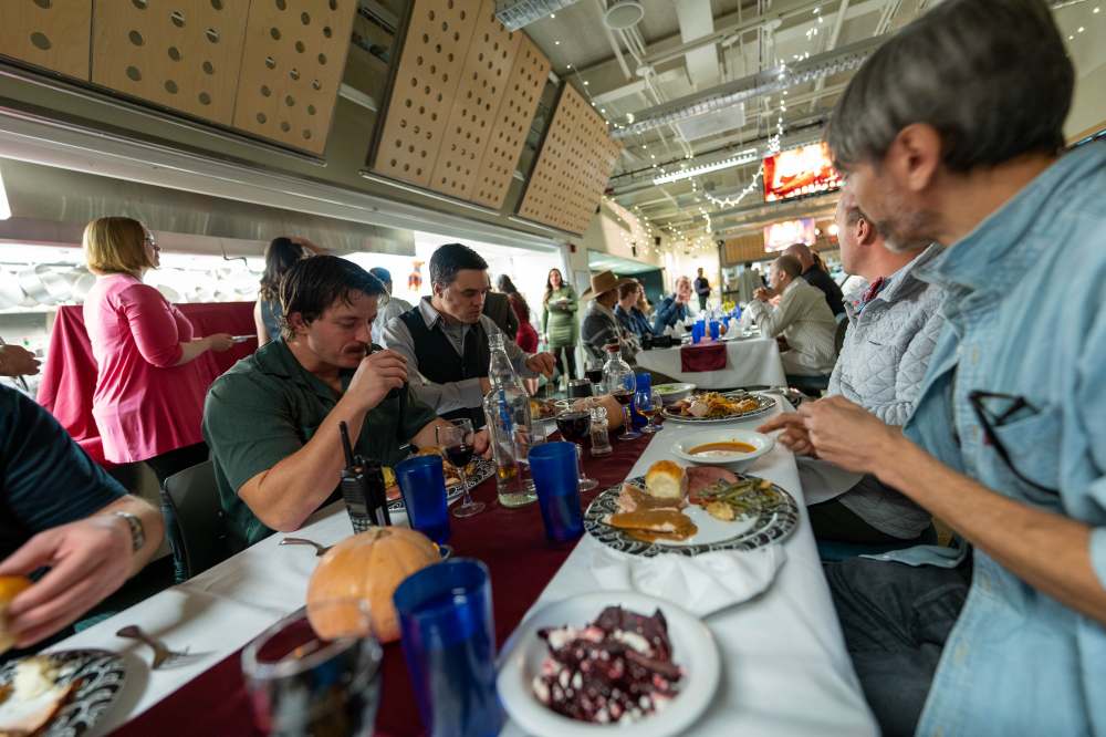 Long view of Thanksgiving dinner table in the South Pole station galley.