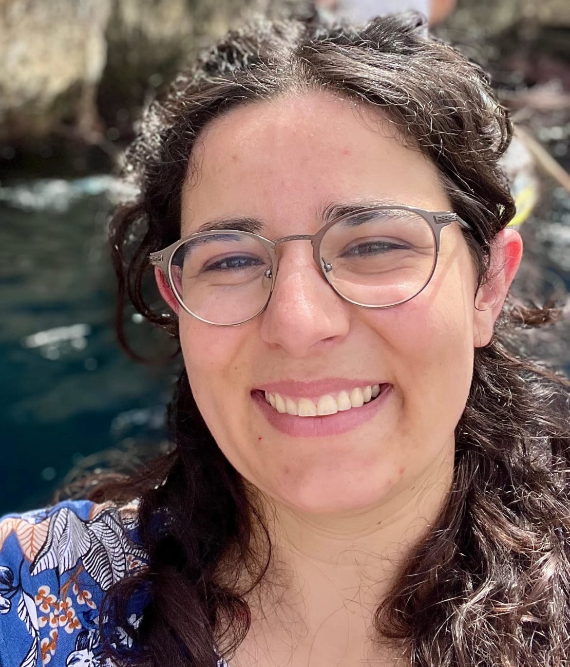 A girl with glasses smiling
