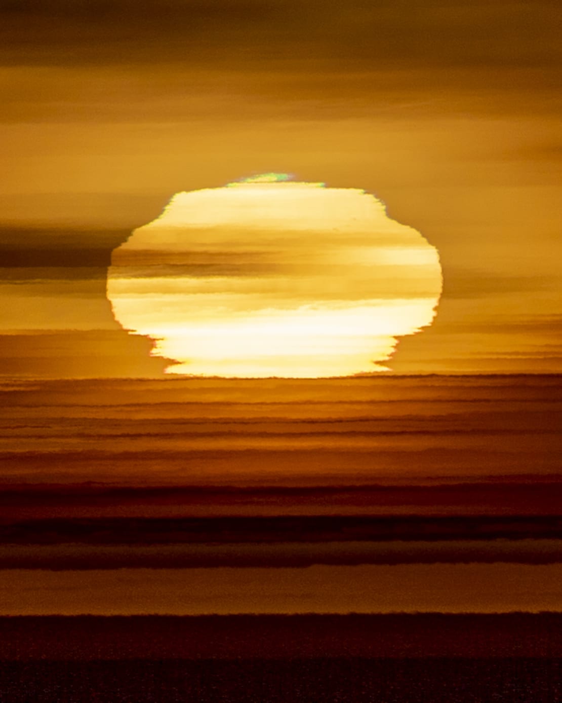 Close-up of green flash at sunrise.