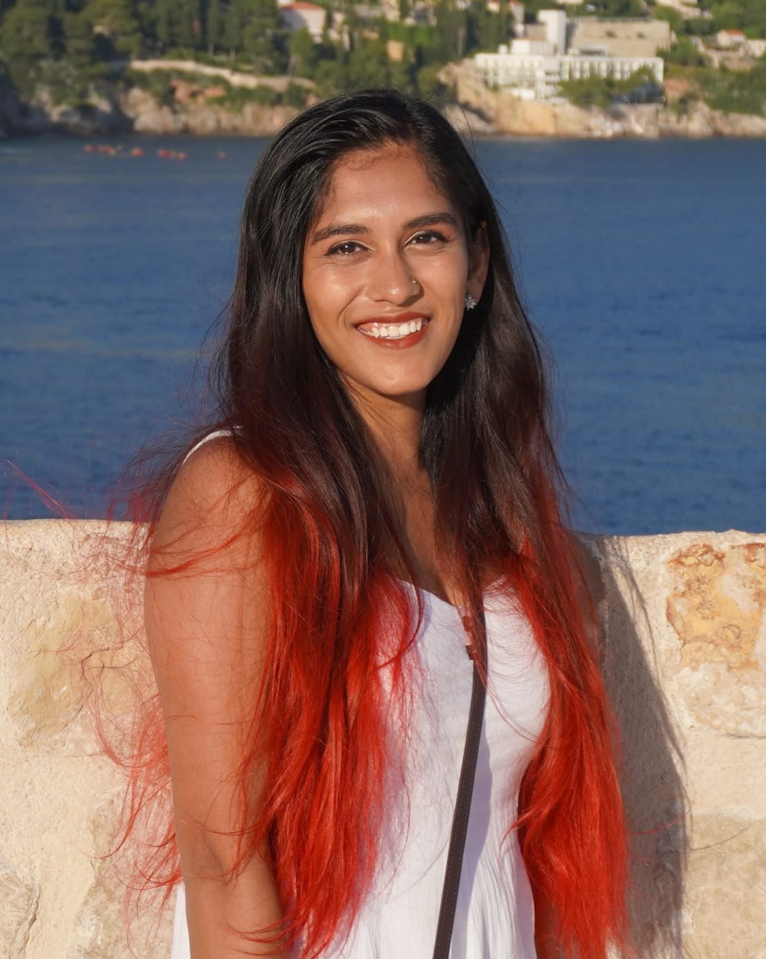 A picture of a girl with red tipped hair