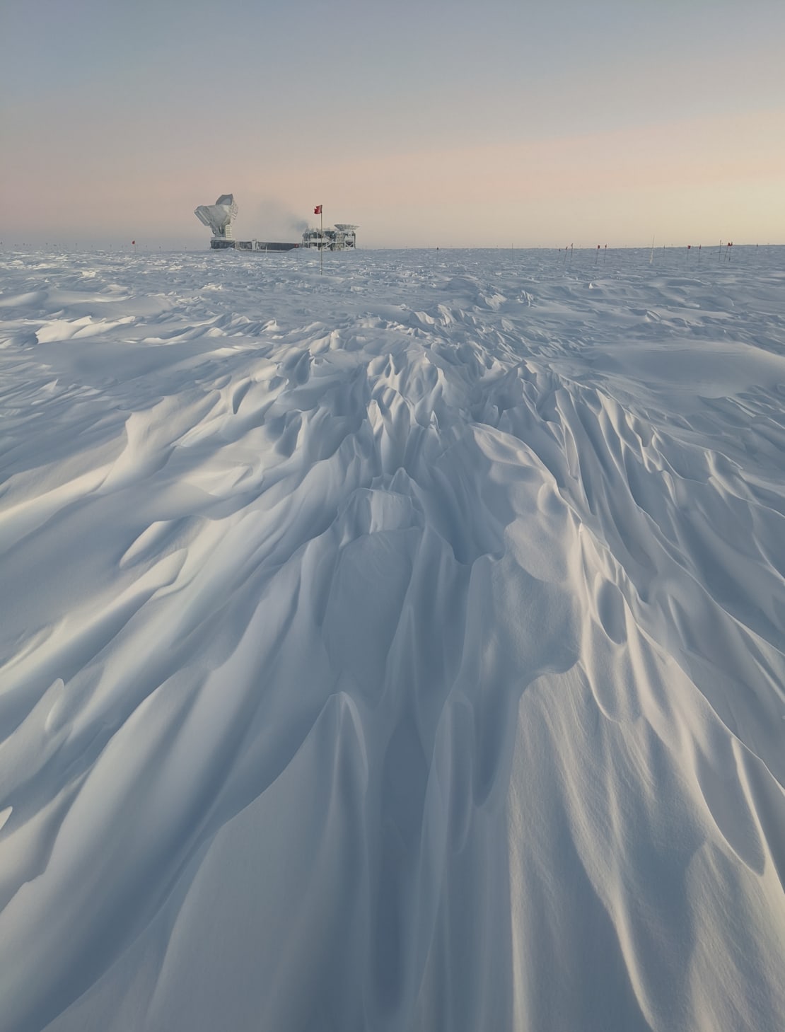 Long rows of sastrugi pointing toward the South Pole Telescope.