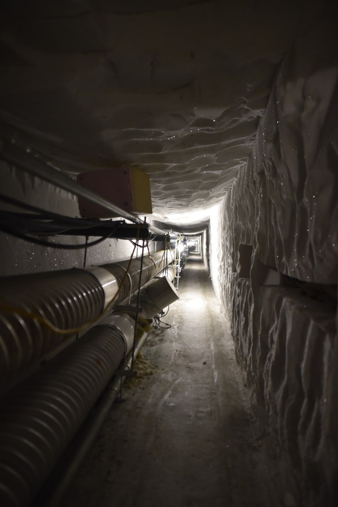 Long view of belowground ice tunnel.
