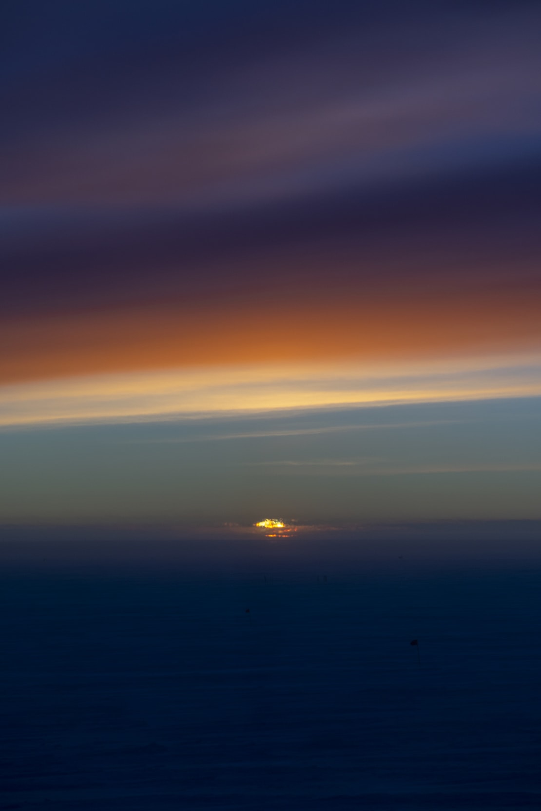 Strong dark colors in sky at sunset at the South Pole.