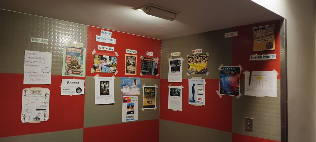 Flyers and posters hung on corner walls.