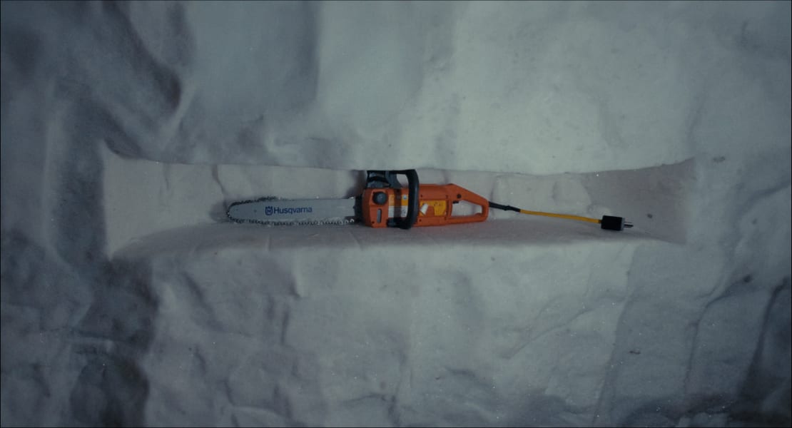 An ice tunnel with a chainsaw