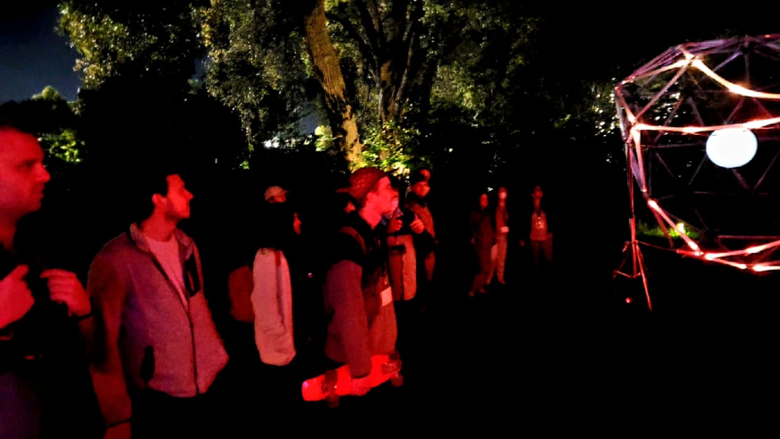 Participants enjoying the GLEAM light show at Olbrich Gardens