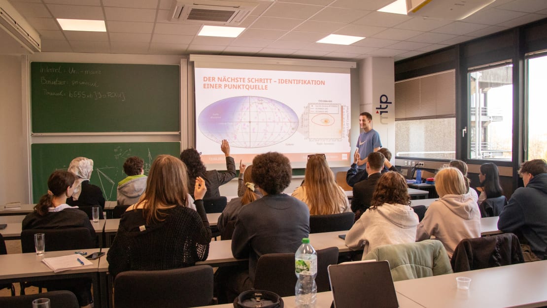 A group of people sitting in a classroom