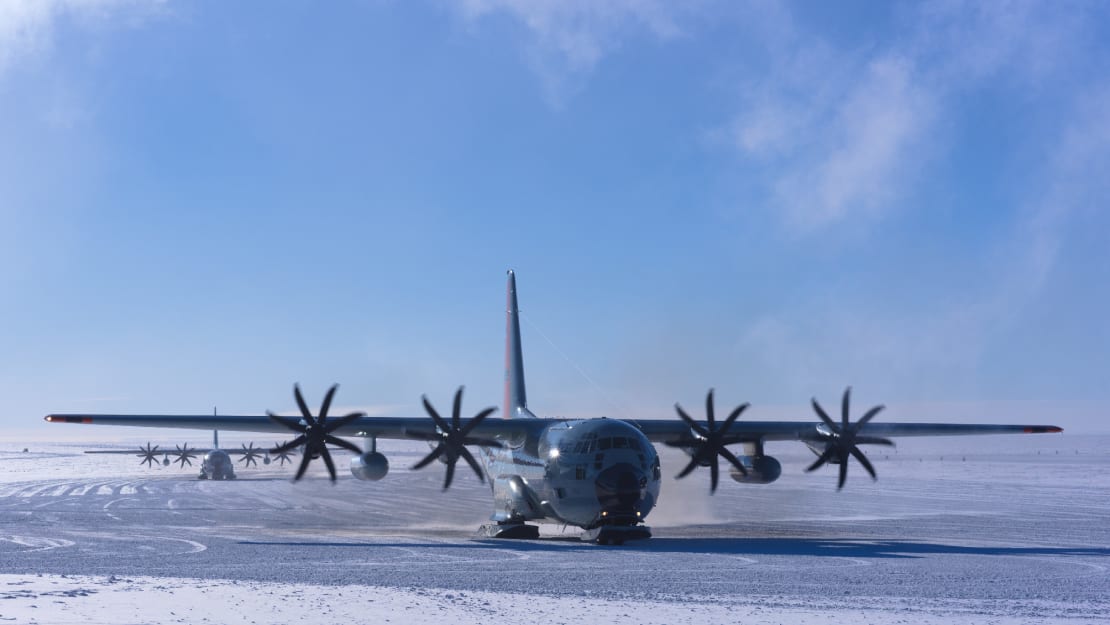 An LC-130 plane seen on its approach on the ice.