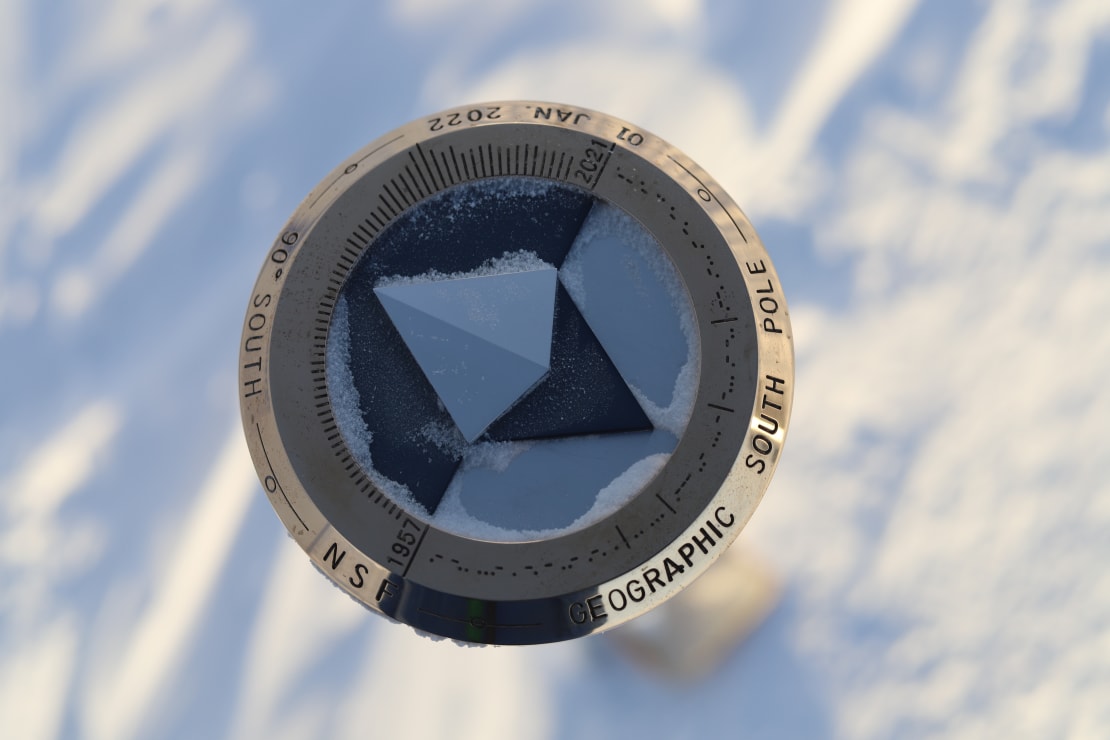 Close-up of top of 2022 geographic South Pole marker.