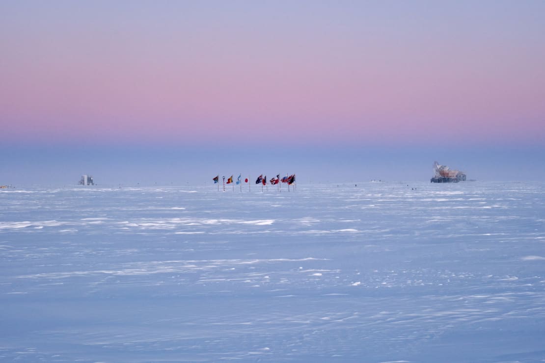 Hazy pink sky at twilight over Dark Sector at the South Pole.