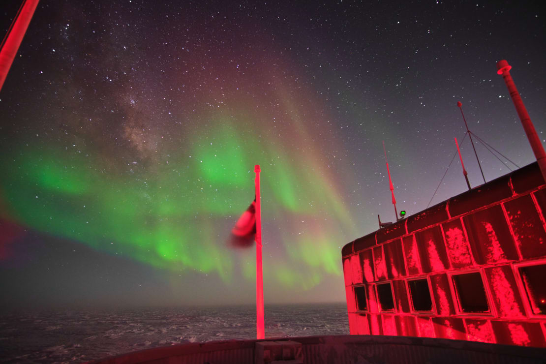 Bright auroras in the sky as seen from the South Pole station’s observations deck.