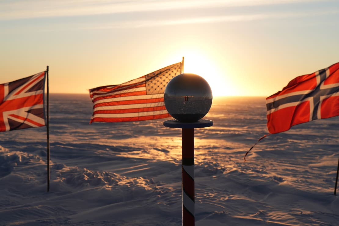 Low sun blocked by ceremonial marker, but shining through the US flag off to the left.