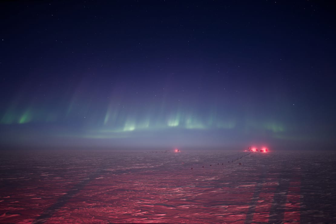 Low and wispy auroras stretching across the the horizon.
