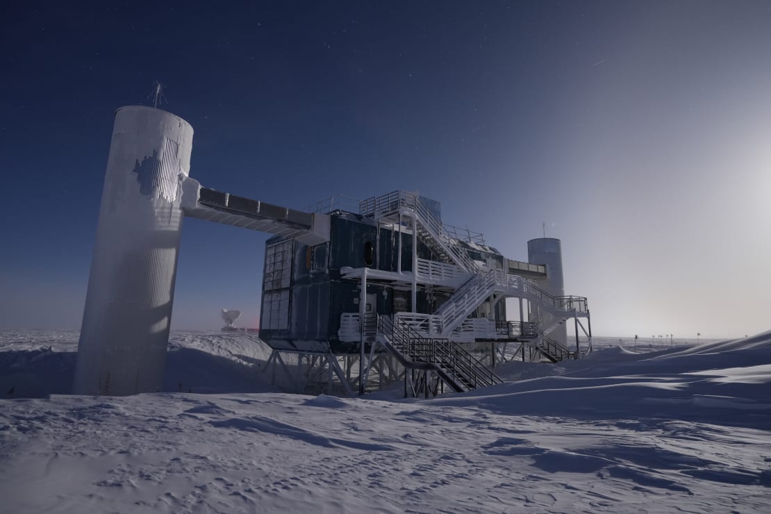 The IceCube Lab brighly lit by moonlight.