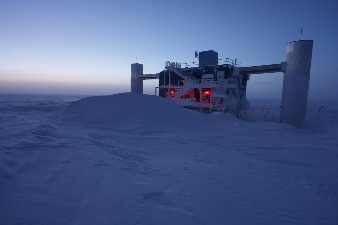Brightening sky at sunrise as backdrop to the IceCube Lab.