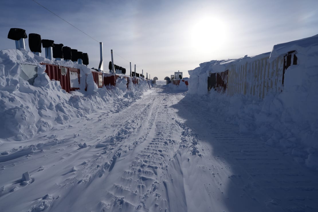 Mostly cleared out path between storage containers of Upgrade drill camp.