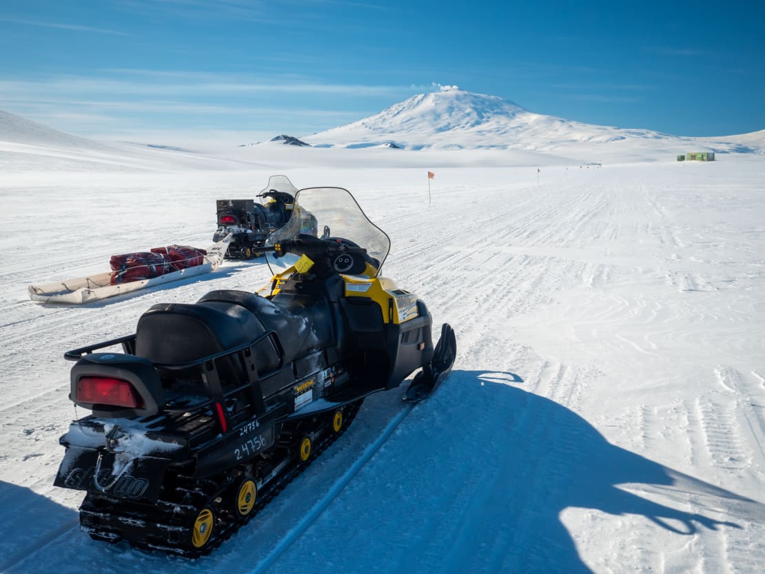 Snowmobiles pointed toward Mount Erebus.