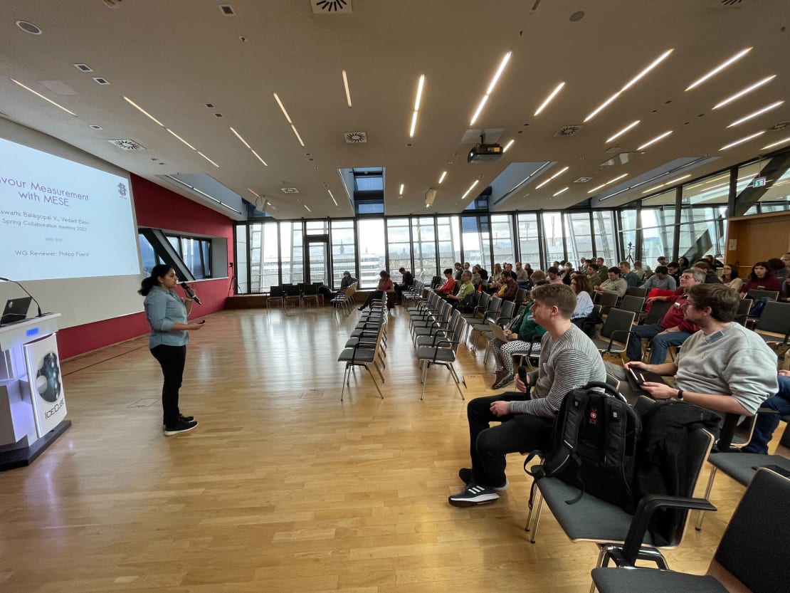 A woman giving a talk in front of a group of people